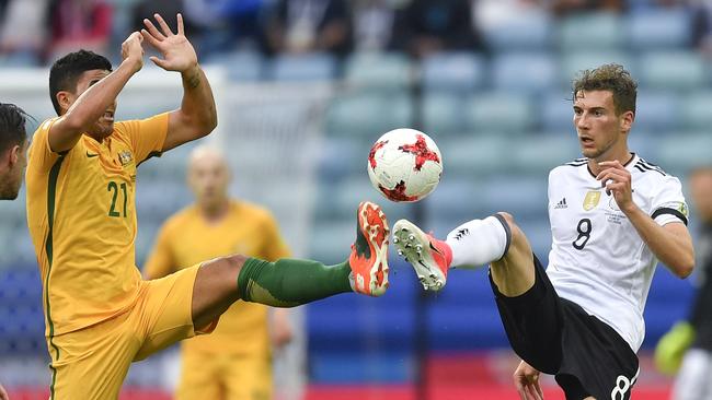 Germany's Leon Goretzka, right, and Australia's Massimo Luongo contest for the ball.