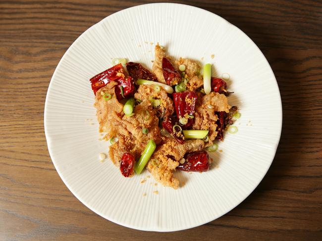 Chopstick through a bowl of chicken crackling at Lee Ho Fook. Picture: Andrew Tauber