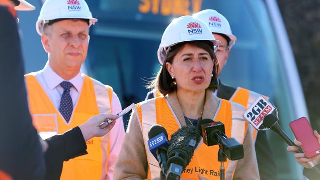 Premier Gladys Berejiklian and Minister for Transport and Infrastructure Andrew Constance unveil the first light rail vehicle on the delayed CBD and South East Light Rail. Picture: Tim Hunter.