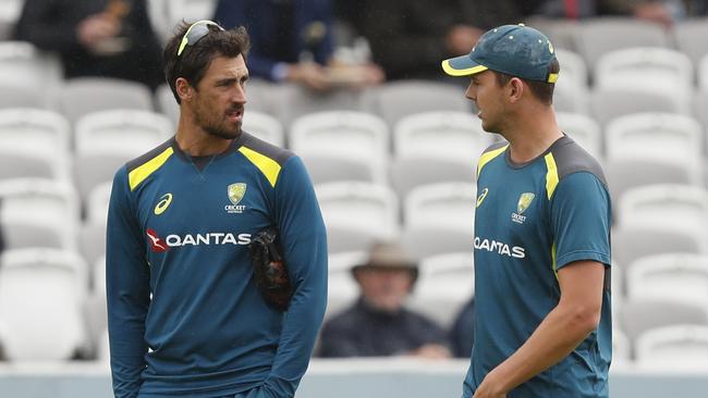 Australian fast bowlers Mitchell Starc, left, and Josh Hazlewood speak during rain delays at Lord’s overnight. Picture: AP