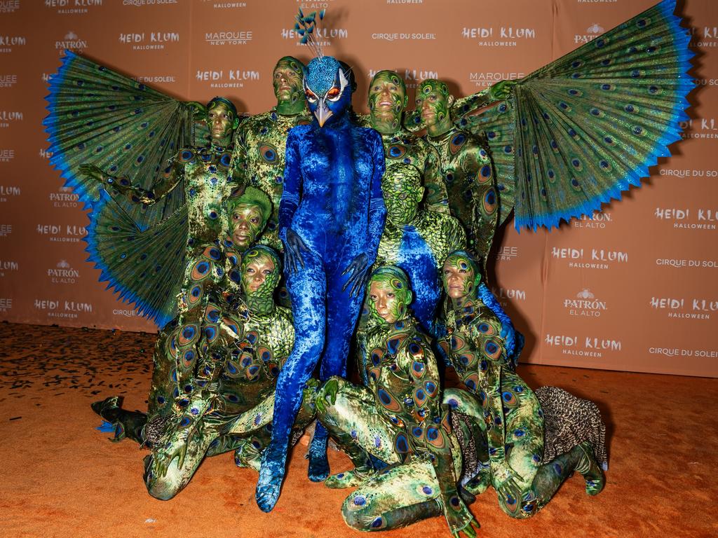 Heidi Klum dresses as a peacock - with a little help from her friends - at her annual Halloween Party in New York. Picture: Gotham/WireImage