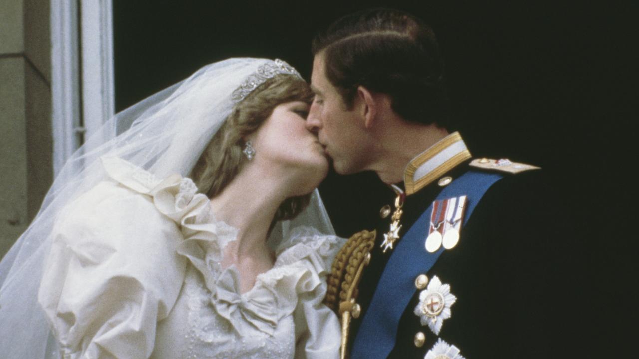 Princess Diana and Prince Charles kissing on the balcony of Buckingham Palace on their wedding day. Picture: Keystone/Getty Images.