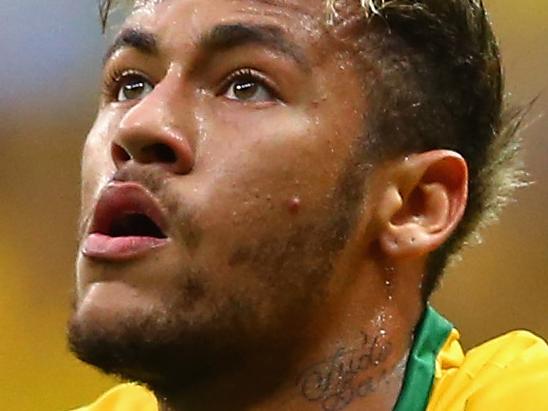 BRASILIA, BRAZIL - JUNE 23: Neymar of Brazil celebrates scoring his team's second goal and his second of the game during the 2014 FIFA World Cup Brazil Group A match between Cameroon and Brazil at Estadio Nacional on June 23, 2014 in Brasilia, Brazil. (Photo by Clive Brunskill/Getty Images)