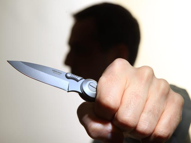 Generic image of a knife-wielding lunatic. Stabbing. Stabbed. Crime. Knife crime. Knives. Man.