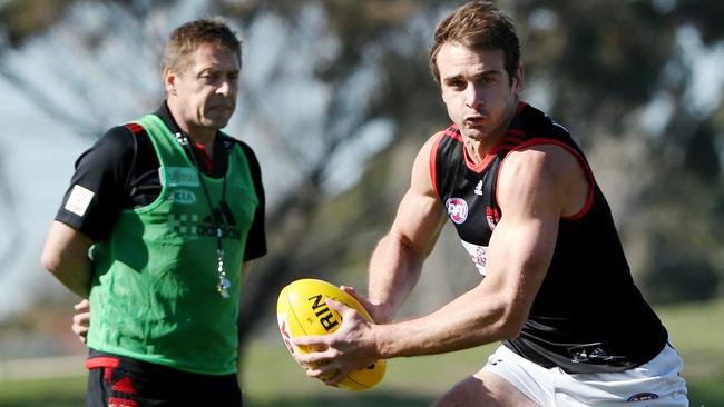 Mark Thompson watches Jobe Watson at Essendon training in 2014. Picture: Colleen Petch