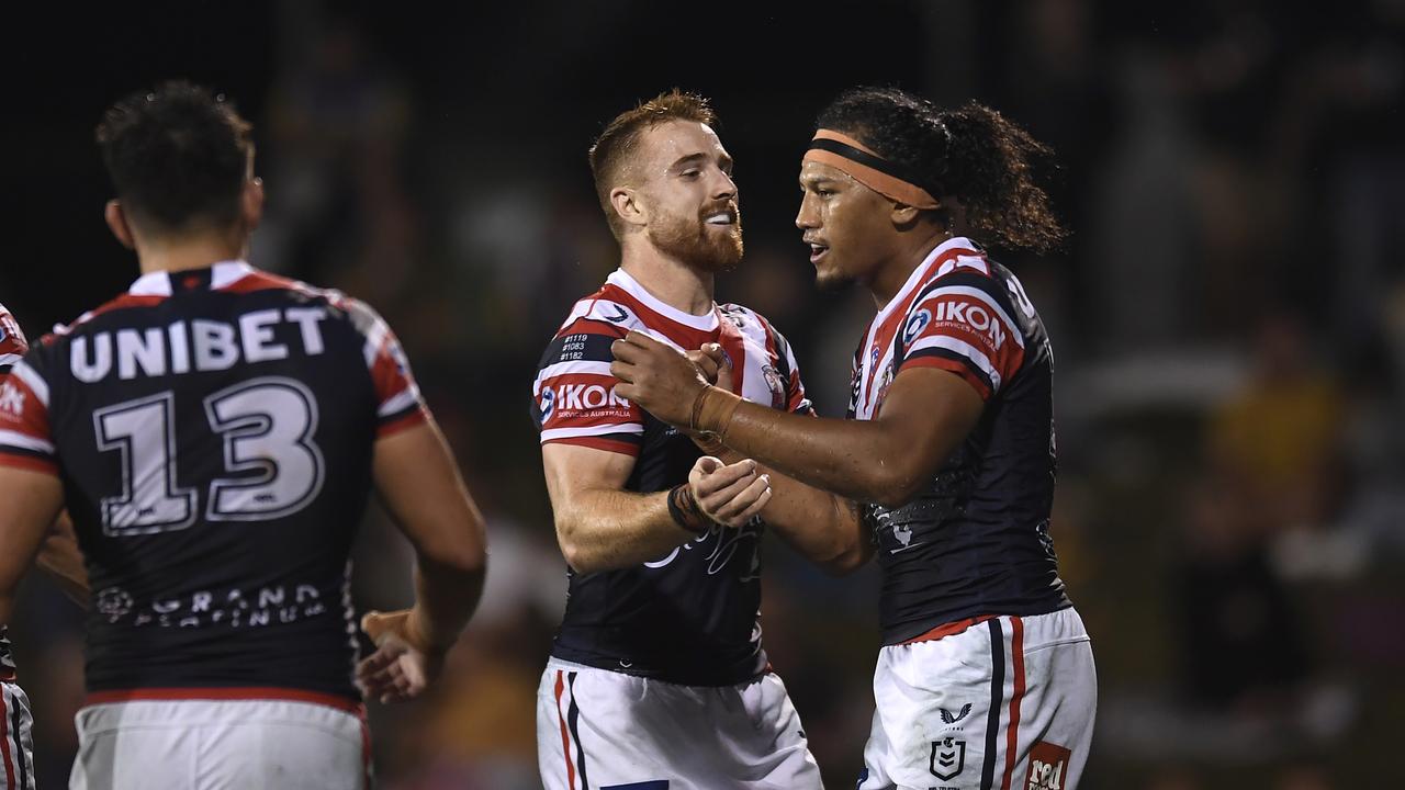 Sitili Tupouniua of the Roosters celebrates with teammates after scoring a try during the round 20 NRL match between the Sydney Roosters and the Parramatta Eels at BB Print Stadium, on July 29, 2021, in Mackay, Australia. Picture: Albert Perez – Getty Images)