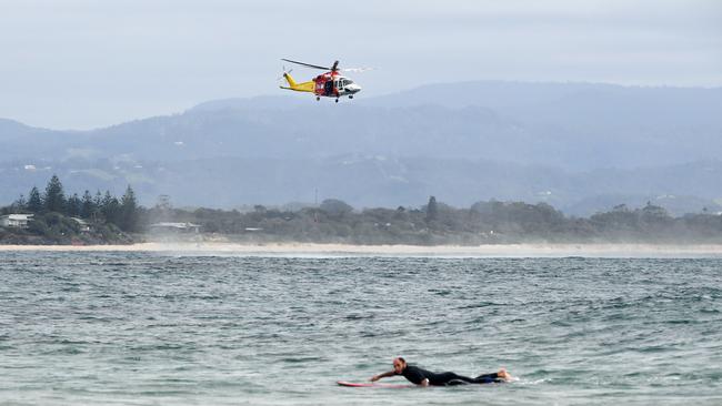 A search and rescue helicopter conducts a coastal search for Theo. Picture: AAP