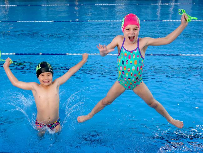 Noah Graham, 6, and Sophia Mitchell, 7, jump for joy at the news. Picture: Steve Pohlner/AAP