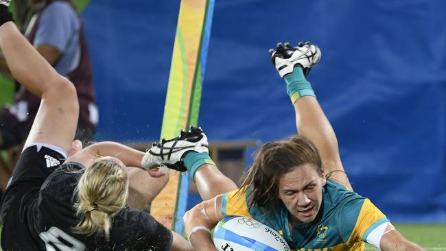 Australia's Evania Pelite scores in the final against New Zealand.