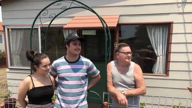 Warren Rodgers (right) helped save his neighbours home in North Rothbury. Jack Haszard (middle) and partner Jess (left). Pic Amy Ziniak