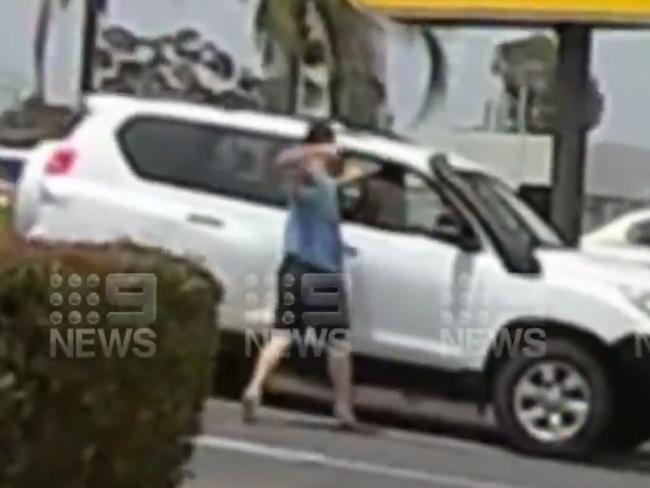 A road rage incident has been caught on video in what appears to be a driveway of a McDonald's restaurant. Image: 9News Adelaide via Ollie Haig