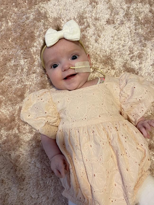 Wren Vodopic, four months old. Wren is a very happy and loving little baby, very cuddly and loves having a conversation with you. She has been a strong fighter recently coming back home from open heart surgery at Royal Children's Hospital and is going good in her recovery.
