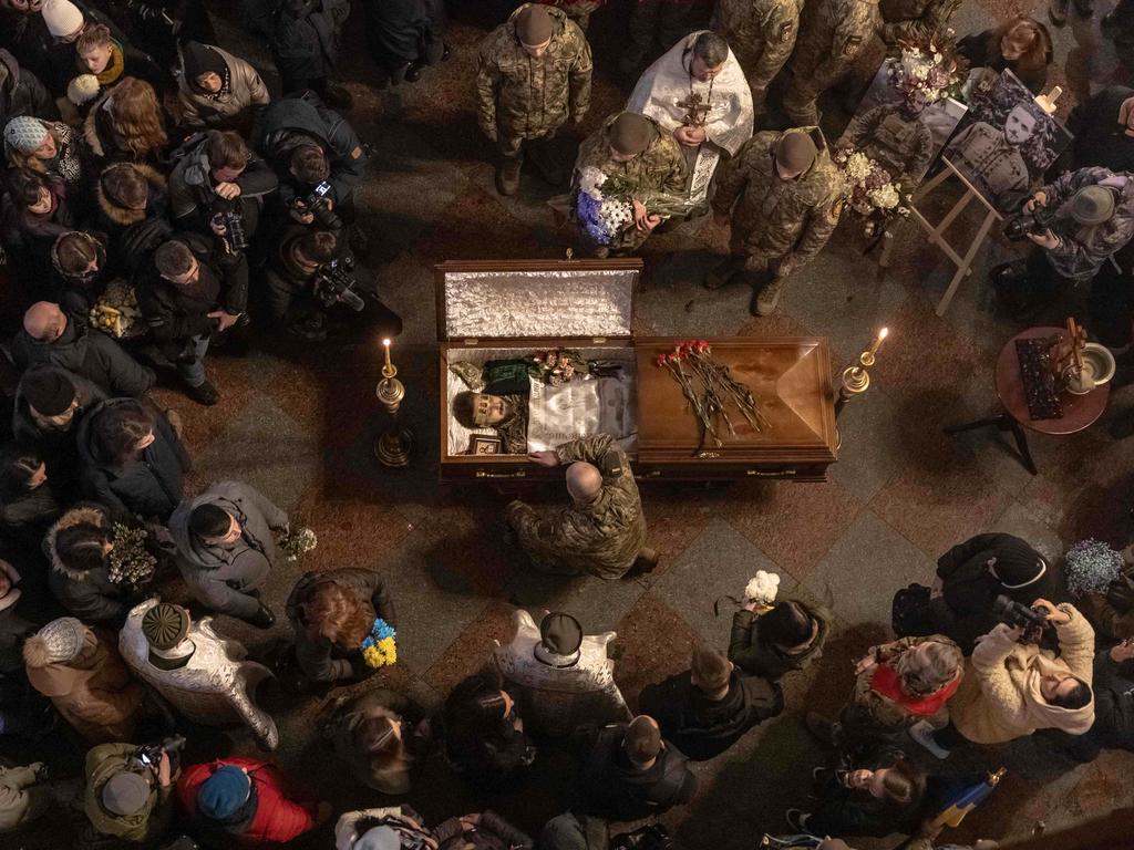 Mourners gather at a Monastery in Kyiv to honour Ukrainian poet-soldier Maksym Kryvtsov, who was killed in battle against Russian forces. Picture: Roman Pilipey/AFP
