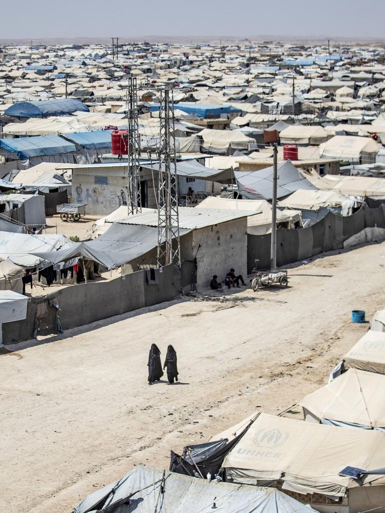 Women walk among shelters at the Kurdish-run al-Hol camp. Picture: Delil Souleiman/AFP