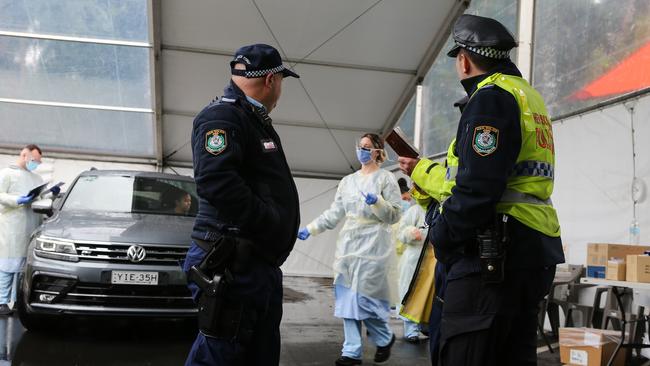 Police arrive at the Covid 19 testing clinic in Homebush today. Picture: NCA Newswire/ Gaye Gerard