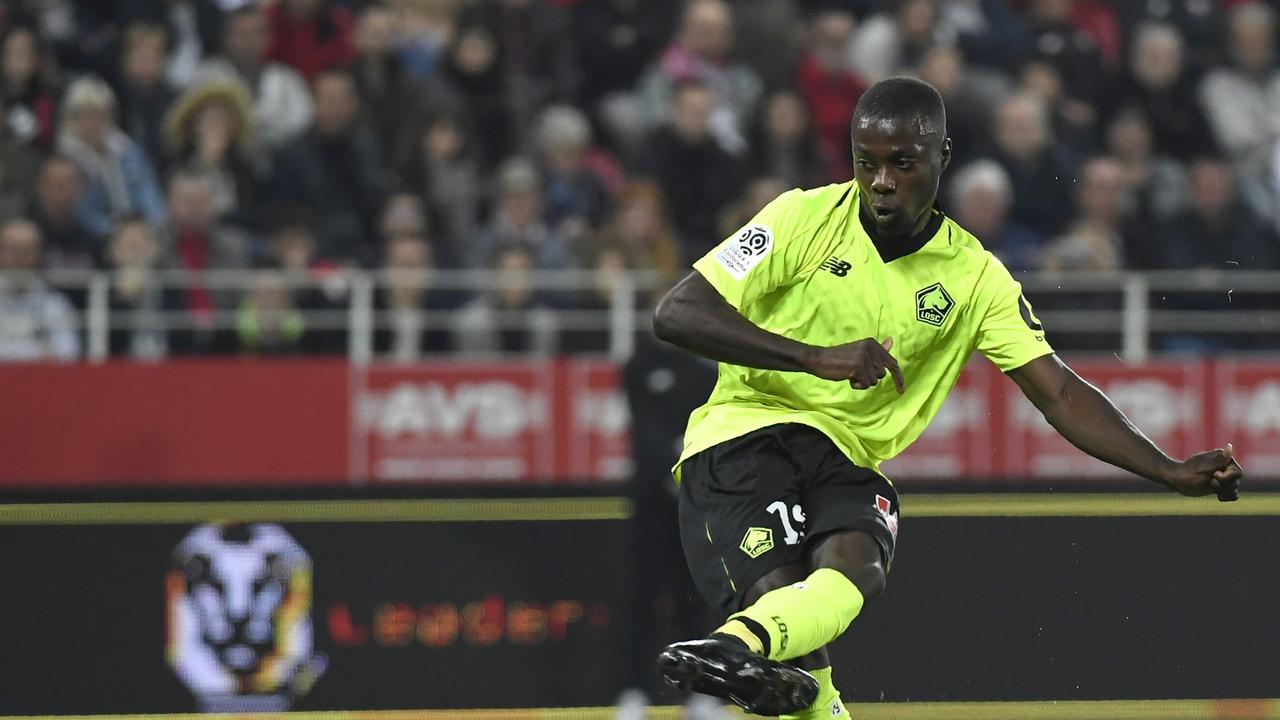 Lille's Ivorian forward Nicolas Pepe shoots and scores
