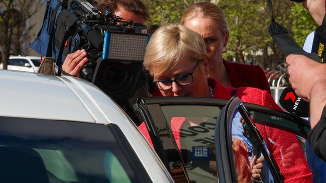 Ms Reynolds enters her vehicle, surrounded by cameras. Picture: Ben Appleton/NCA NewsWire