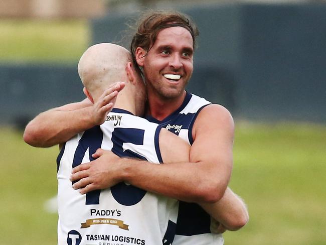 Port Douglas captain Kye Chapple and Adam Gross celebrate winning the AFL Cairns men's grand final match between the Port Douglas Crocs and the South Cairns Cutters, played at Cazalys Stadium. PICTURE: BRENDAN RADKE