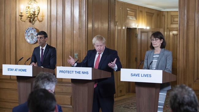 British Prime Minister Boris Johnson (centre) at a press conference with Chancellor of the Exchequer Rishi Sunak and Deputy Chief Medical Officer Dr Jenny Harries. Picture: Getty