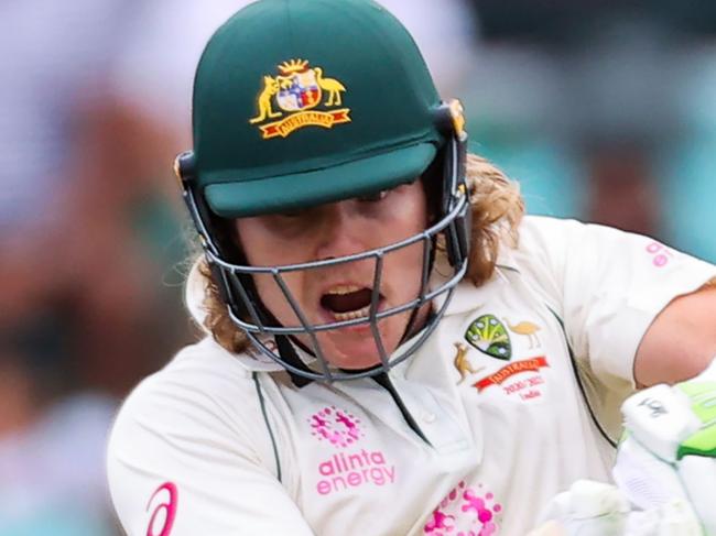 TOPSHOT - Australia's Will Pucovski plays a shot during the first day of the third cricket Test match between Australia and India at the Sydney Cricket Ground (SCG)in Sydney on January 7, 2021. (Photo by DAVID GRAY / AFP) / -- IMAGE RESTRICTED TO EDITORIAL USE - STRICTLY NO COMMERCIAL USE --