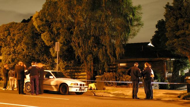 Police at the East Kew home and murder scene of Terence and Christine Hodson in 2004.