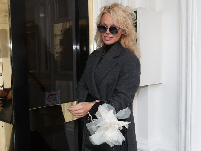 Pamela Anderson arrives to visit Julian Assange at the Ecuadorian embassy in London on February 23, 2017. Picture: Jonathan Brady/PA Wire/AAP