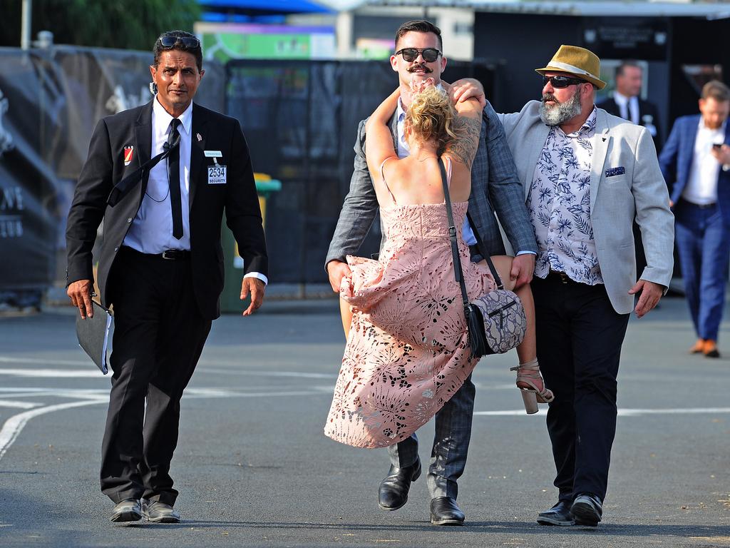 An interesting way to get carried home at Doomben on Melbourne Cup in 2018. Picture: John Gass/AAP
