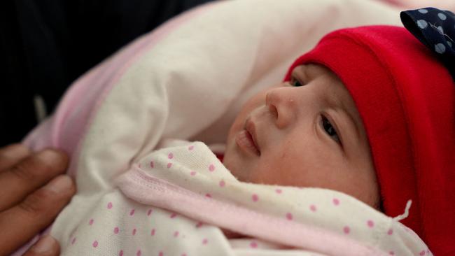 Afraa was born under the rubble after the earthquake that hit Turkey and Syria killed her parents and siblings. Picture: AFP