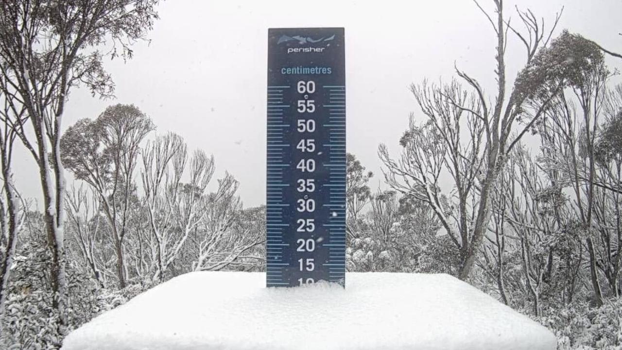 Perisher’s snow stake showed about 10cm of snow. Picture: Perisher
