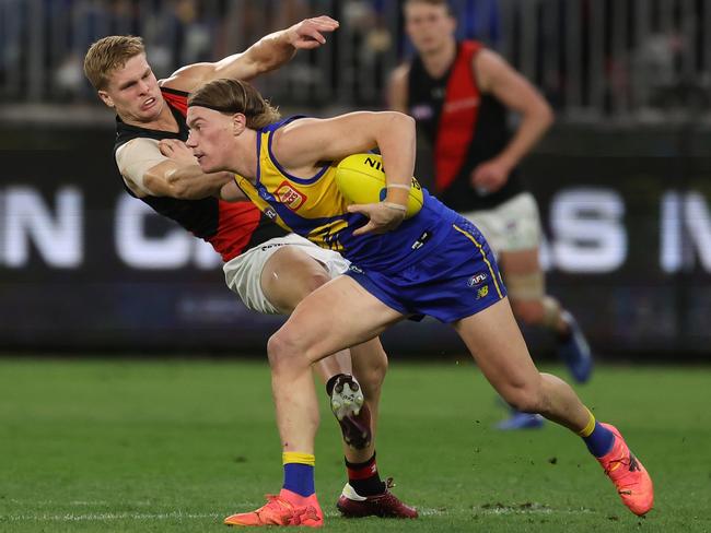 Harley Reid fends off Ben Hobbs. Picture: Will Russell/AFL Photos