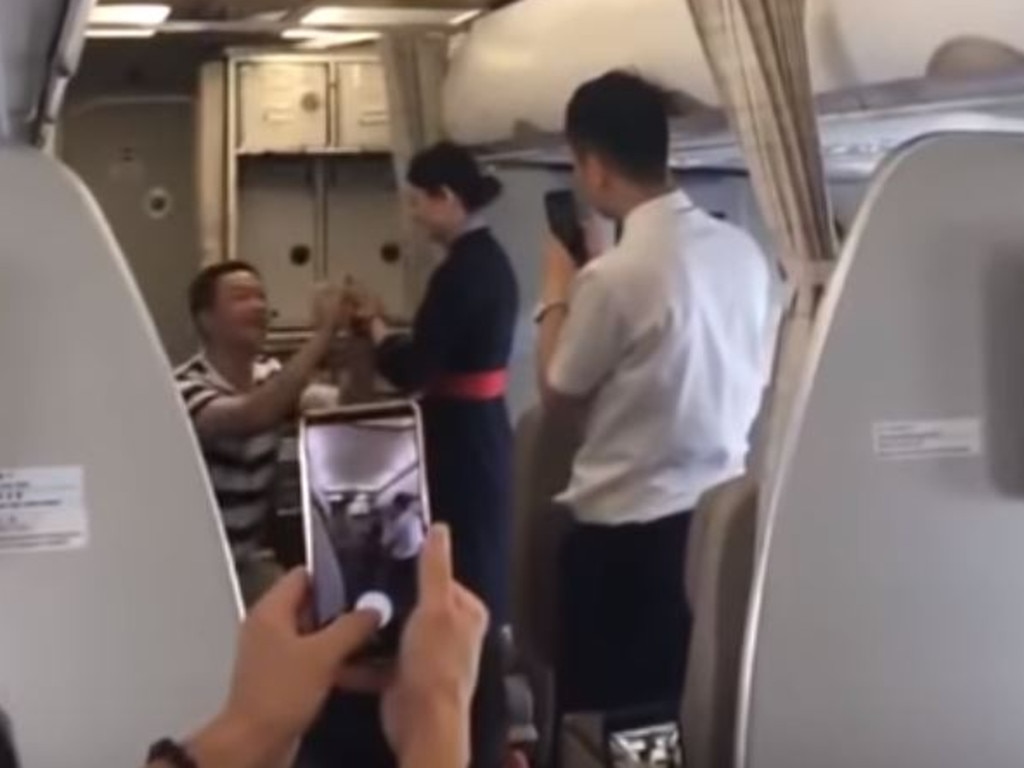 The moment the flight attendant’s boyfriend popped the big question. Picture: YouTube