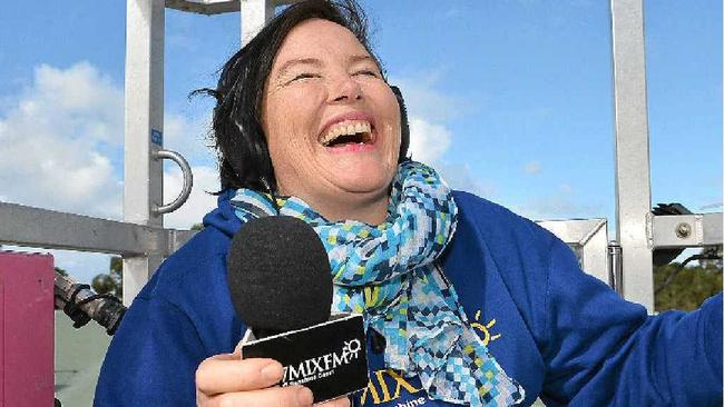 ON A HIGH: Caroline Hutchinson from MIX FM is raising money for charity by broadcasting from the top of a crane. Picture: Warren Lynam