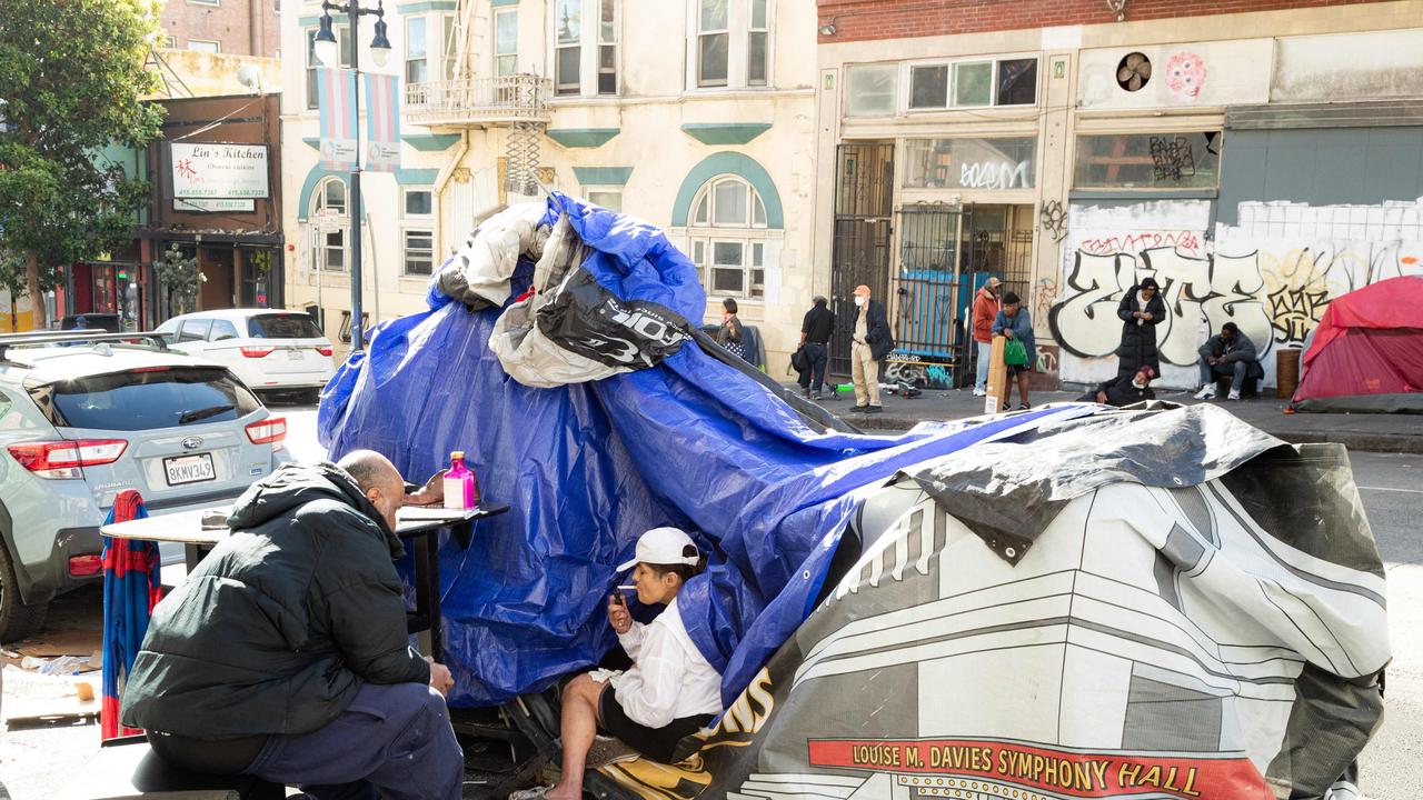 People and their belongings are seen on Jones Street in San Francisco, on November 13, 2023. San Francisco has struggled to clean up the city ahead of hosting world and business leaders. Picture: Jason Henry/AFP