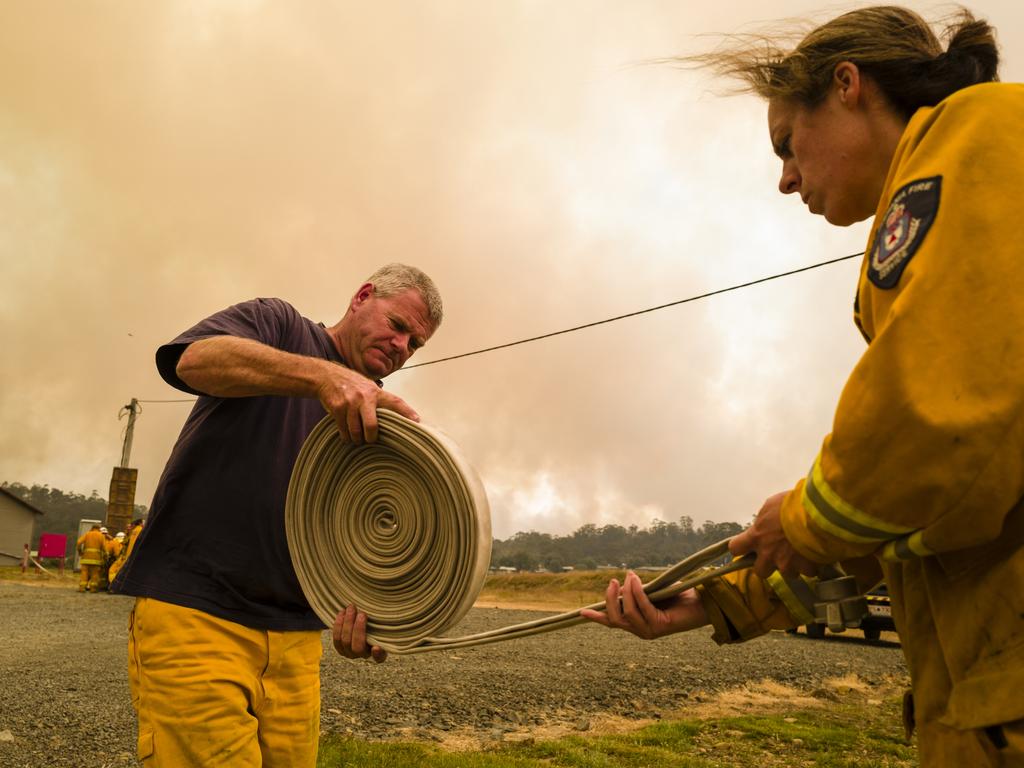 Firefighters prepare their equipment as they get ready to tackle the blaze at Miena. Picture: Heath Holden/Getty