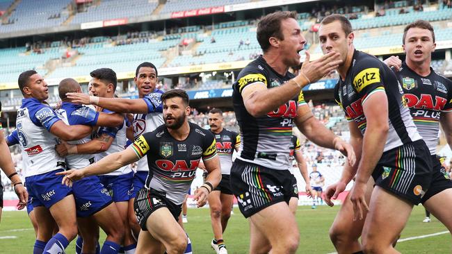 Penrith's James Maloney objects to a try scored by Bulldogs Moses Mbye during the Bulldogs v Penrith rugby league match at ANZ Stadium. Picture: Brett Costello