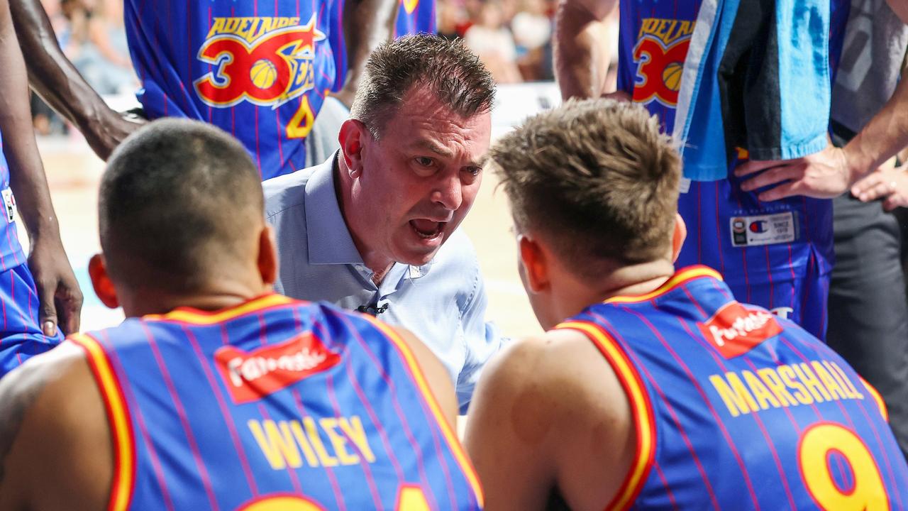 Interim coach Scott Ninnis speaks to his charges during a time out in his side’s win over the Kings. Picture: Sarah Reed/Getty Images.