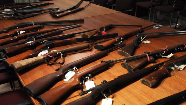 A selection of guns handed into police during a firearm amnesty in Tasmania, Tuesday, Nov 19, 2013. (AAP Image/David Beniuk)