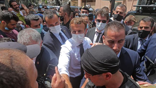 Emmanuel Macron greets devastated crowds in the Gemmayzeh neighborhood. Picture: AFP.