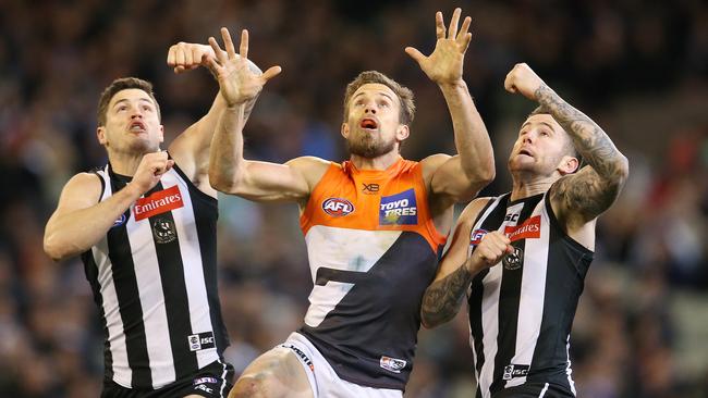 Brett Deledio is sandwiched by Jeremy Howe and Jack Crisp. Picture: Michael Klein