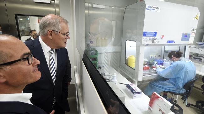 Scott Morrison and Victorian Deputy Premier James Merlino tour The Peter Doherty Institute for Infection and Immunity in Melbourne before announcing a deal for local manufacture of the Moderna Covid vaccine. Picture: NCA NewsWire / Andrew Henshaw