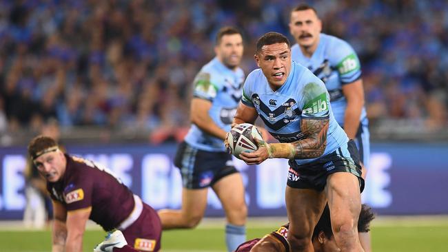 MELBOURNE, AUSTRALIA - JUNE 06:  Tyson Frizzell of the Blues is tackled during game one of the State Of Origin series between the Queensland Maroons and the New South Wales Blues at the Melbourne Cricket Ground on June 6, 2018 in Melbourne, Australia.  (Photo by Quinn Rooney/Getty Images)