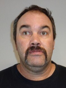 Stuart Confoy, 45, is wanted by police on seven charges.