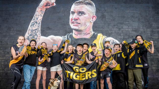 Young Tiger fans visit the the Dustin Martin mural. Picture: Jake Nowakowski