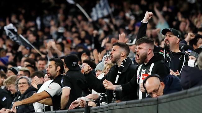 Collingwood fans celebrate during the 2022 AFL first qualifying final.