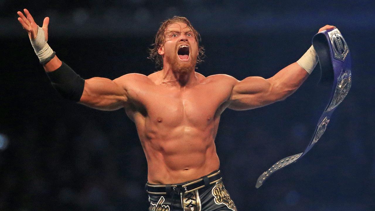 Melbourne’s Buddy Murphy celebrates winning the WWE Cruiserweight Championship at WWE Super Show-Down at the MCG. Picture: Mark Stewart