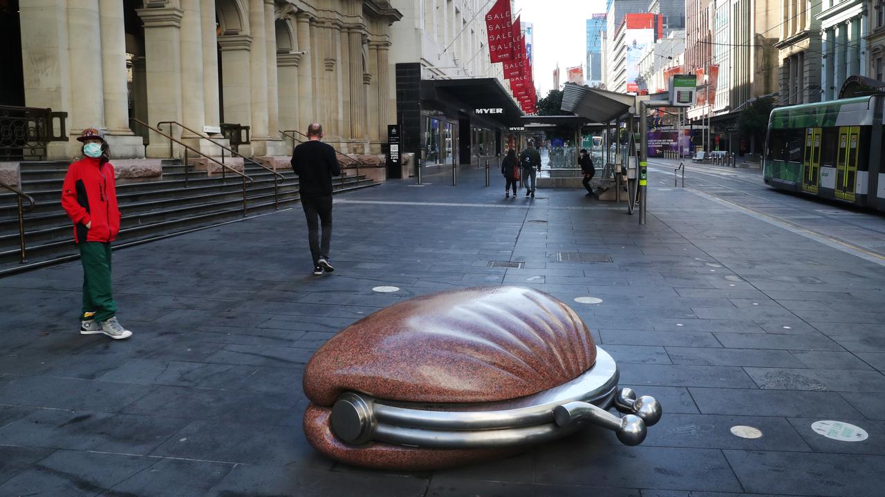 People get their daily exercise in an empty Bourke Street mall this week. Picture: NCA NewsWire / David Crosling