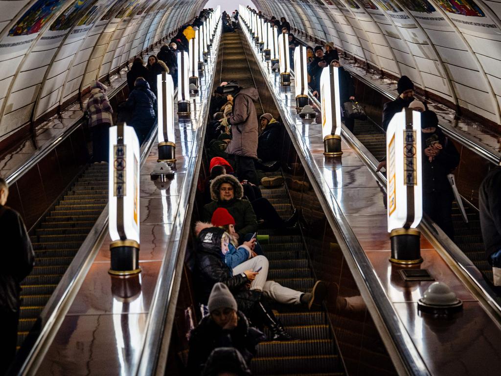 Civilians take shelter inside a metro station during air raid alert in the centre of Kyiv on December 13, 2022, amid the Russian invasion of Ukraine. Picture: Dimitar Dilkoff / AFP.