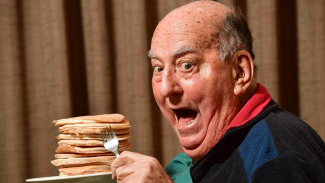 Roger Meadmore, then aged 83, tucks into a stack of pancakes at the Pancake Kitchen in Adelaide, in 2017. Photo: Keryn Stevens