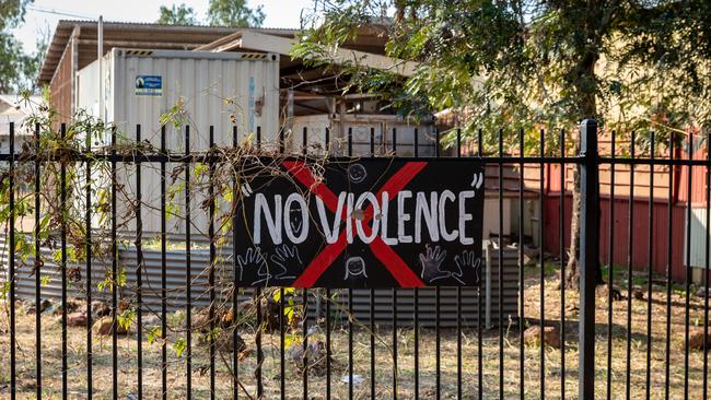 The largely ignored sign on the fence outside the community store in Wadeye. Picture: Amos Aikman