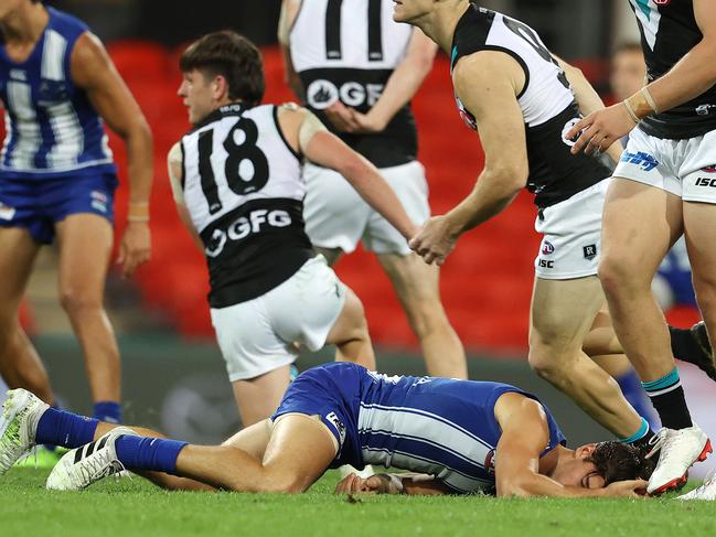 AFL Round 16. North Melbourne vs Port Adelaide at Metricon Stadium. 05/09/2020...  Jy Simpkin of the Kangaroos gets the staggers after being hit head high by Zak Butters of the Power q3  . Pic: Michael Klein